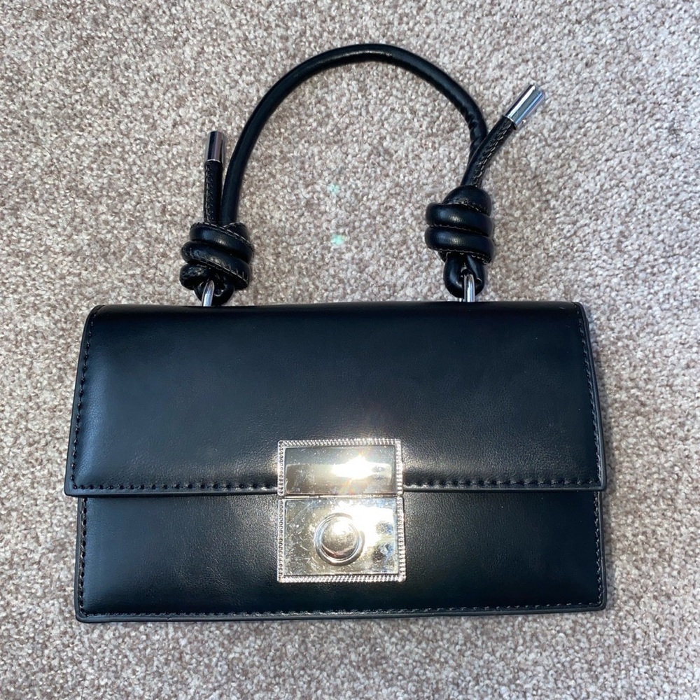Never used. Can be used as crossbody or Handbag